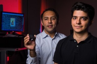 Rice scientist Aydin Babakhani, left, one of four university researchers who have won a new grant to develop new terahertz technologies, shows a microchip that put out the shortest pulse ever measured from such a small device. The chip designed by Babakhani and graduate student Mahdi Assefzadeh, right, is seen as a step toward the ability to use terahertz for wireless communications and other applications. Photo by Jeff Fitlow - See more at: http://news.rice.edu/2014/06/24/terahertz-tech-gets-a-major-push-at-rice-2/#sthash.UFTCQNGK.dpuf